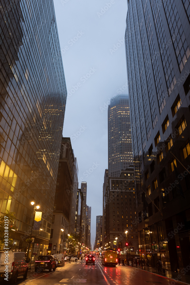 Obraz premium Evening Cityscape with Tall Skyscrapers and Street Traffic. Manhattan, NYC