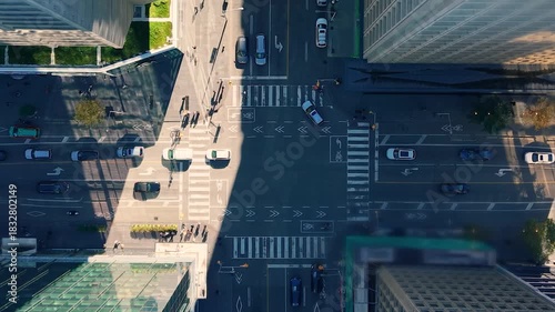 Aerial view of busy crossroads, building rooftops, skyscrapers in downtown Toronto, Ontario, Canada.
