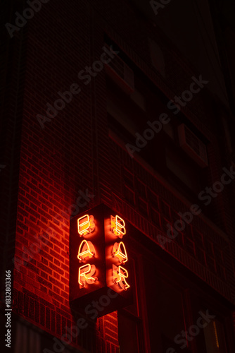 Neon Bar Sign in Urban Night Scene. Manhattan, NYC