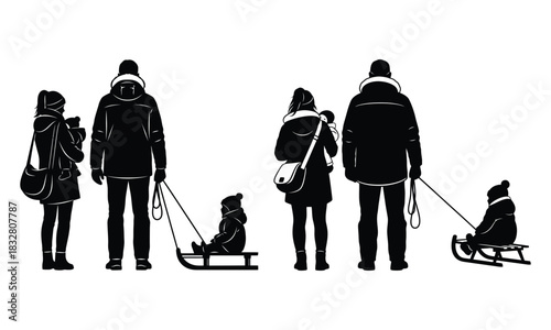 Silhouette of a family tobogganing