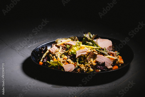 Bowl of salad with tuna steak