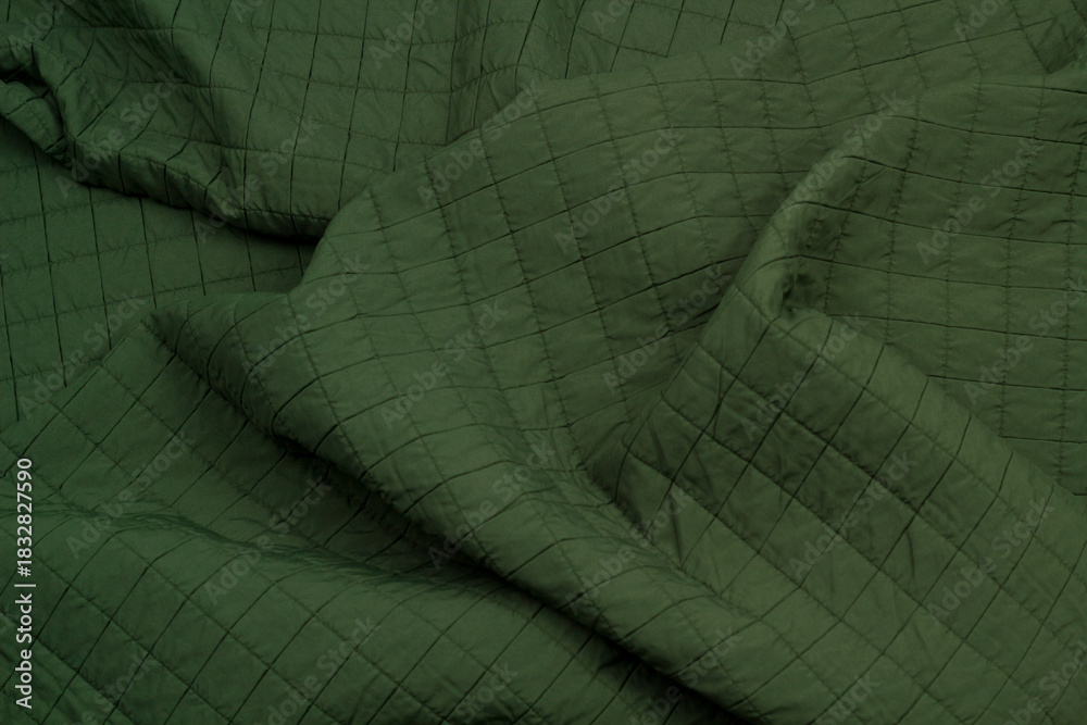 Naklejka premium Quilted fabric. The texture of the blanket. Background to your project
