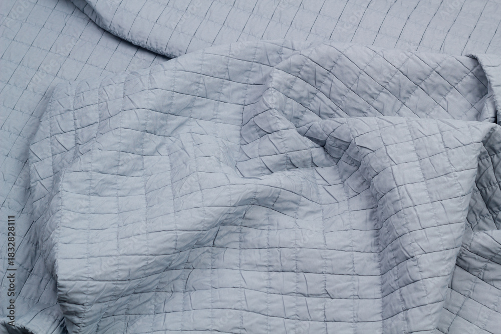 Naklejka premium Quilted fabric. The texture of the blanket. Background to your project