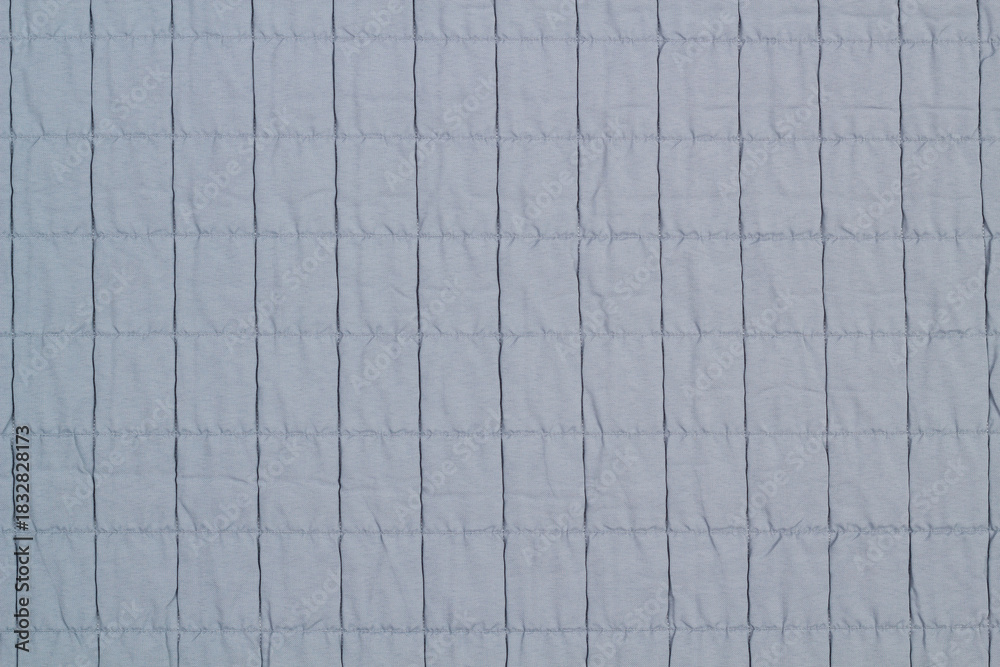 Naklejka premium Quilted fabric. The texture of the blanket. Background to your project