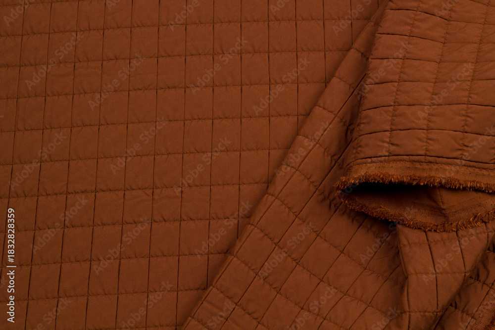 Naklejka premium Quilted fabric. The texture of the blanket. Background to your project