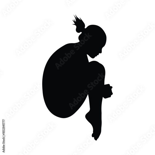 Graceful young woman in a contemplative pose silhouette