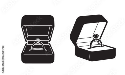 Two open jewelry boxes displaying engagement rings in a simple black silhouette style