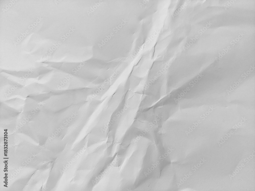 Obraz premium White crumpled paper texture background featuring a wavy surface. Crumpled white paper pattern texture.
