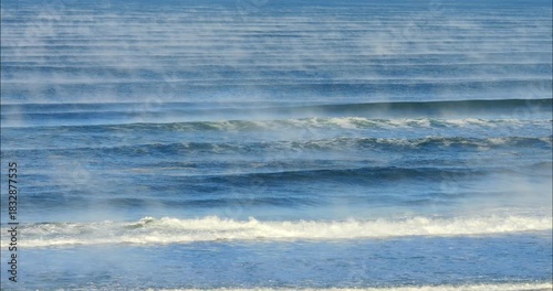 Beautiful ocean landscape with mist rising from the water temperature 