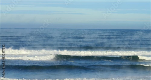 Beautiful ocean landscape with mist rising from the water temperature 