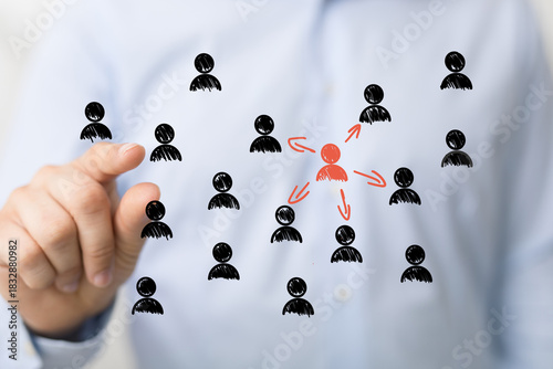 Hand pointing at a central ...