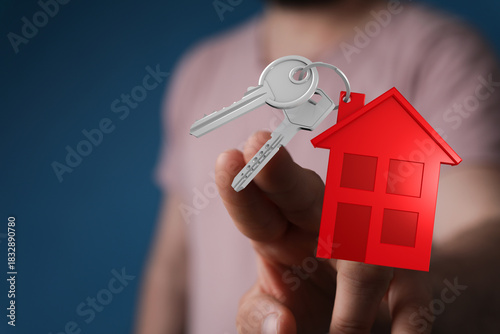 A person's hand holding key...