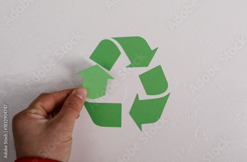 A hand positioning a green ...