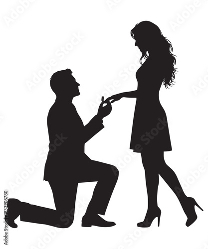 Romantic marriage proposal silhouette of a man kneeling to offer a ring to a woman