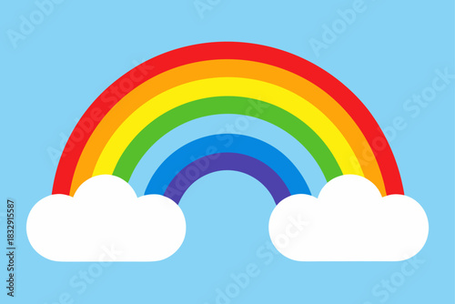 Bright rainbow arching over white clouds against a blue sky