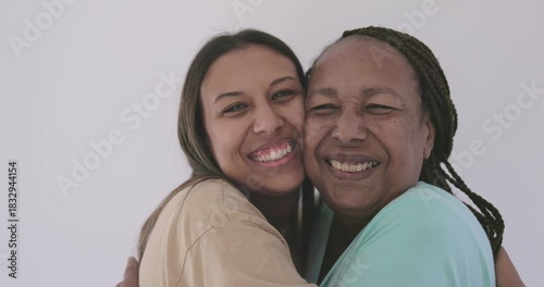 Happy african mother and daughter having tender moment at home - Love and family concept 