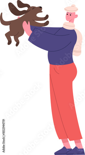 Person joyfully playing holding a happy dog