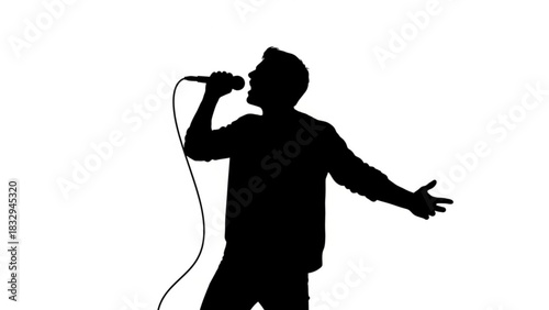 Silhouette of a man singing into a microphone with arms outstretched in a white background setting