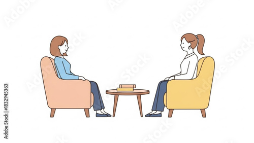 Two women sitting in armchairs facing each other with a table between them in a counseling session