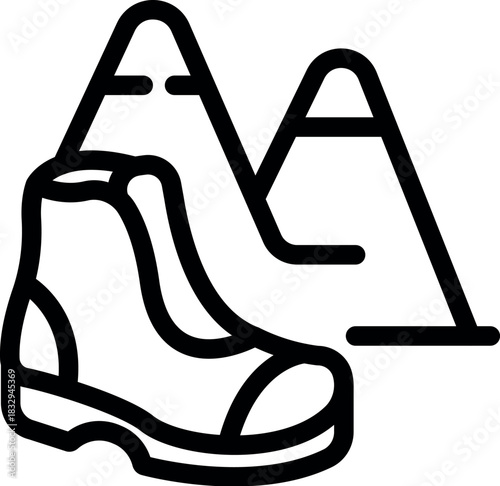 Hiking boot placed in front of mountains, symbolizing the concept of preparing for a challenging outdoor adventure