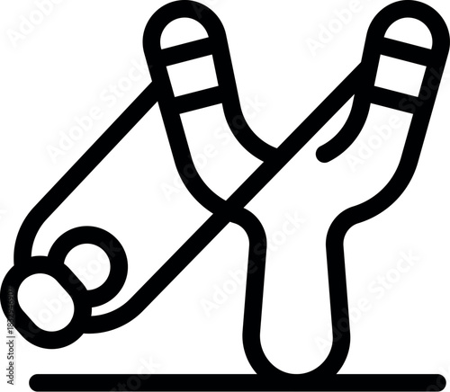 Classic wooden slingshot ready to launch stones, fun outdoor activity for children