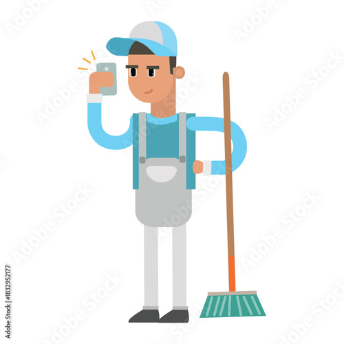 Cleaning worker holding a broom while looking at his mobile phone or taking a selfie