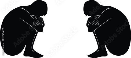 Two solitary figures silhouetted in contemplation