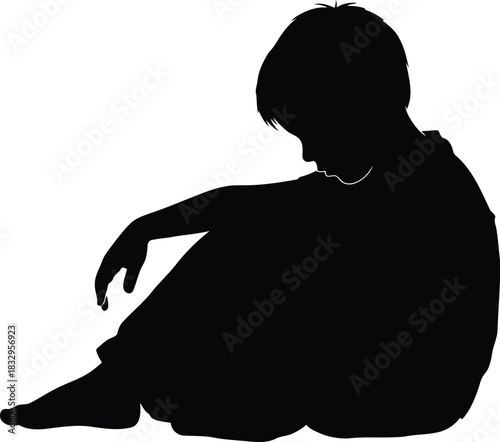 Silhouette of a sad boy sitting, feeling lonely and depressed