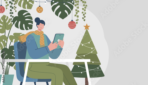 Woman uses tablet in a festive indoor space with plants and Christmas decorations