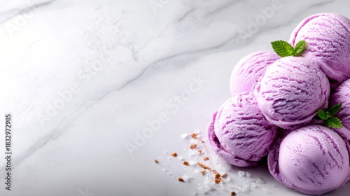 Delicious scoops of lavender ice cream are artfully arranged on a cool marble surface, representing indulgence and the joy of a sweet treat.