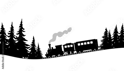 Vintage steam train passing through silhouette of pine trees  