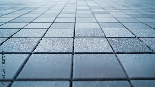 Enjoying a peaceful morning walk on a smooth city sidewalk as sunlight breaks through at dawn