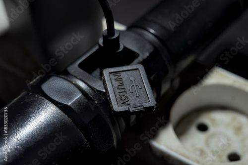 Flashlight charging through USB cable.