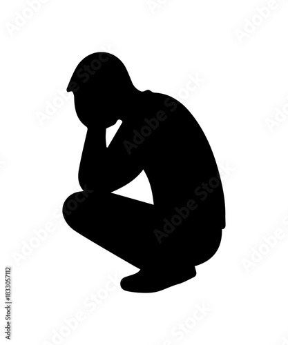 Man silhouette crouching in despair feeling depressed
