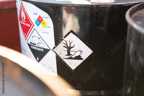 Environmental impact hazard placard sign on the chemical barrel. The chemical will create biological pollution if it leaking to the environment.