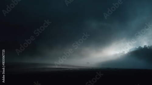 Atmospheric landscape with dark clouds filling the sky, subtle gradient from black to lighter shades,
