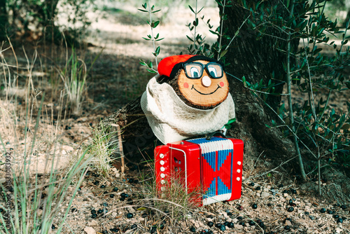 a Tio de Nadal with glasses in the forest