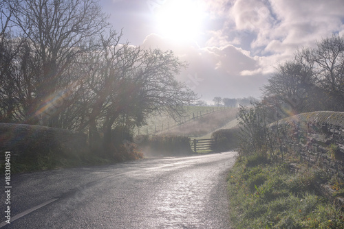 Beautiful sunny and cold December morning in the south west, UK. Low lying mist being slowly burnt back by bright autumn, winter sunshine