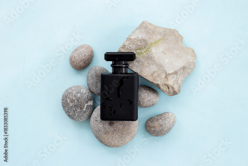 Wallpaper Mural Stylish black perfume bottle with water drops. Male fragrance concept Torontodigital.ca