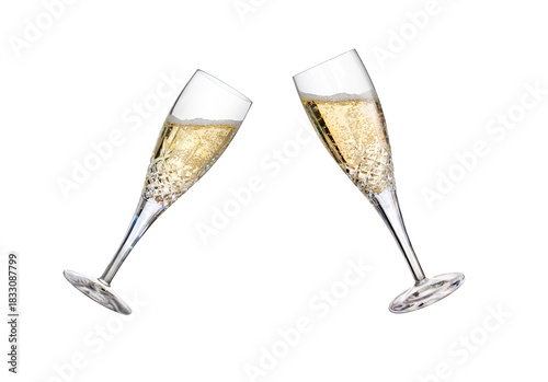 Two champagne glasses, flutes, tilted with fizzy wine as a birthday celebration or to celebrate the New Year with different amounts of fizzy bubbles isolated on a transparent background.