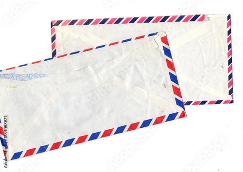 Obraz na plátně The reverse of grubby old Air Mail envelopes on a white background
