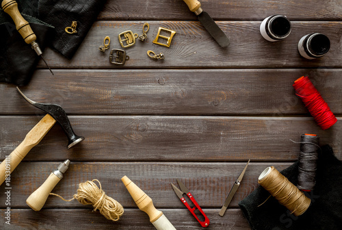 Wallpaper Mural Frame flat lay of leather craftsman or shoemaker tools and equipment, top view Torontodigital.ca