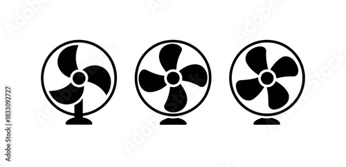Three black electric fans are lined up in a row on a white background.