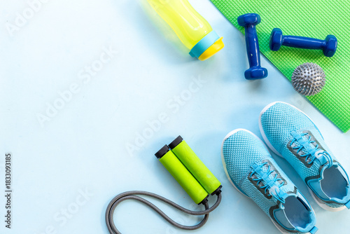 Wallpaper Mural Sport fitness tolls flat lay with sneakers and dumbbells, top view Torontodigital.ca