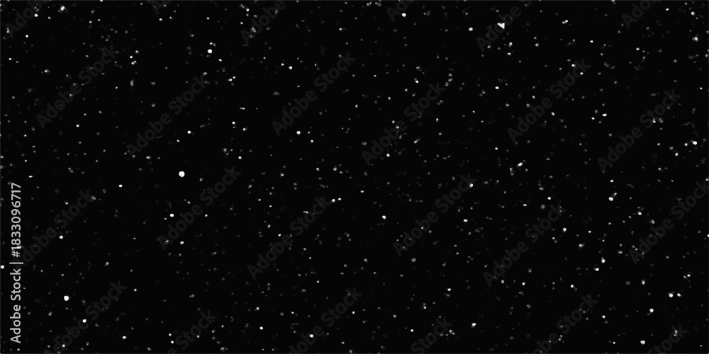 Fototapeta premium Falling snow flakes against a dark, cosmic night sky of sparkling star dust and light