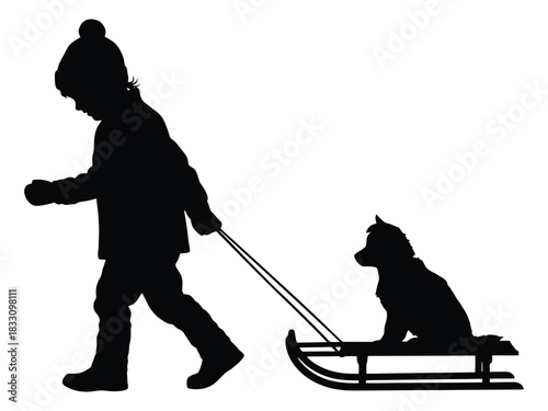 A young child pulls a sled with a dog on it creating a winter silhouette scene