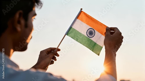 Man Holding Indian Flag on Rooftop at Sunrise
