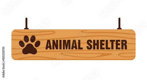 A wooden sign displaying the words animal shelter with a paw print