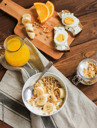 healthy breakfast bowl of yogurt with granola and eggs