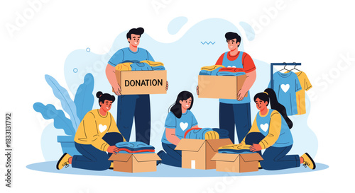 Diverse volunteers enthusiastically pack donations of clothes into boxes for charity.